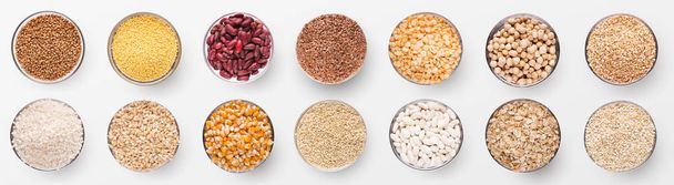 Collection of various grains in bowls isolated on white background, panorama, top view